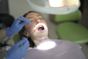 BDS - DENTIST checking teeth